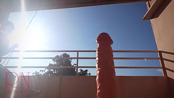 The housewife is swinging on a swing on the summer terrace. The bitch sits down, makes a blowjob to a dildo, sits astride a big silicone dick.